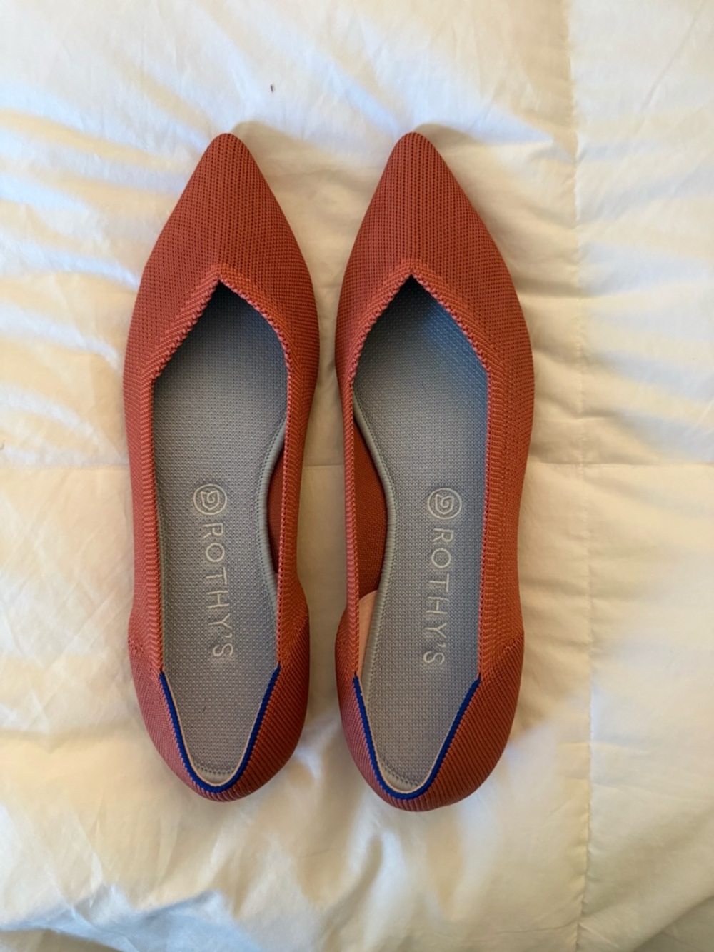 Rothy's Pointed Knit Flats in Terracotta with Blue Trim
